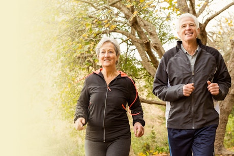 An elderly couple walking as part of their commitment to stay healthy with diabetes.
