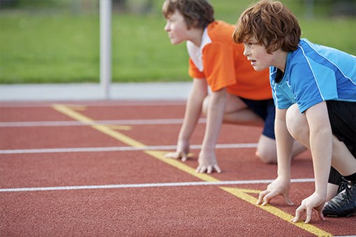 Children on a track and ready to race as part of the Fitnessgram program.