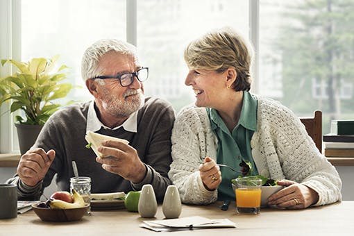Man and daughter sharing a healthy meal.