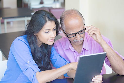 A man and his daughter learning about cancer clinical trials