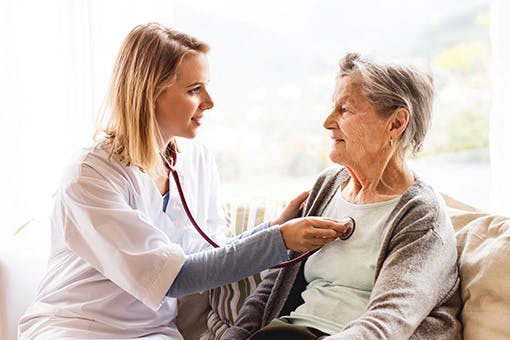 Nurse from the Screening for Life program treating a patient