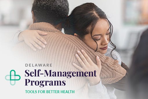 A woman hugging her dad as he manages his cancer.